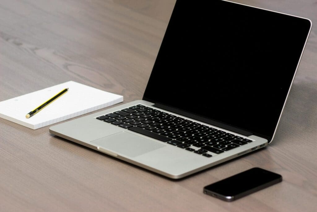 Free Silver Macbook Beside Iphone Stock Photo